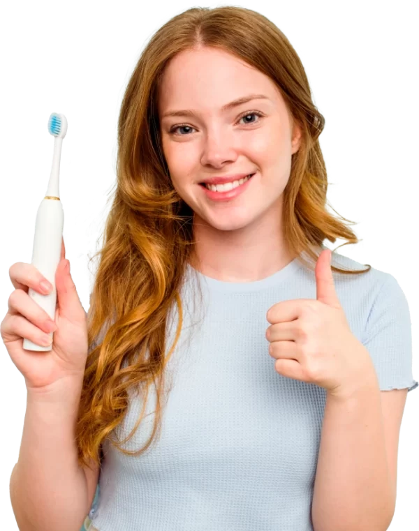 Woman brushing her teeth with an electric toothbrush for effective oral hygiene at Professional Dental in Utah