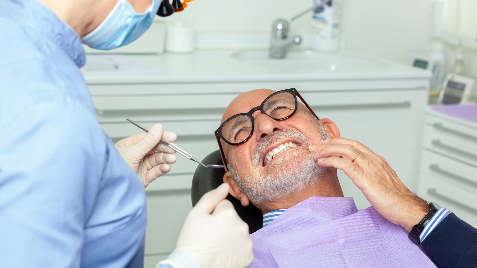 Dentist examining patient for gum disease (periodontitis) symptoms in Utah.