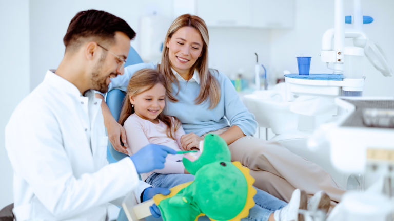 Happy child receiving a gentle dental exam from Dr. Douglas Bowen at Professional Dental in Lehi or Eagle Mountain, Utah. Dr. Bowen is a board-certified pediatric dentist fluent in Spanish.