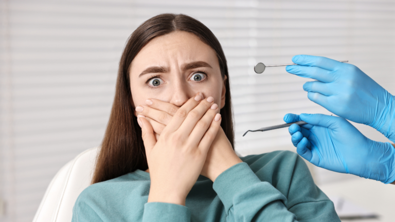 Patient speaking with a dentist about dental anxiety and ways to feel more comfortable during a dental appointment.